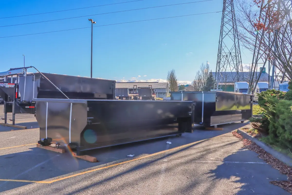 Roll-off dumpster ready for waste disposal at job site for Concrete Dumpster Rental in Fairhope